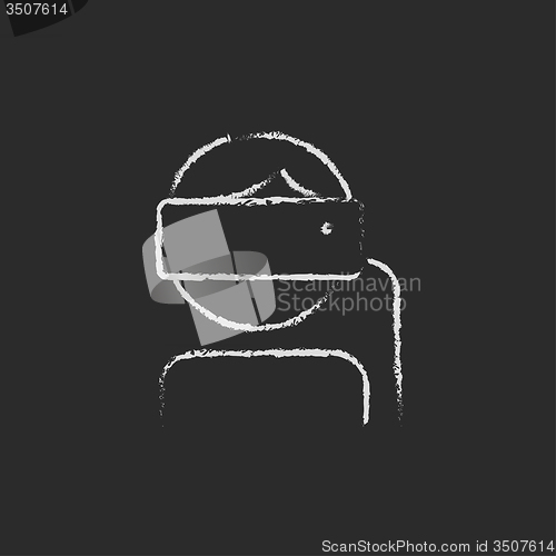 Image of Man wearing virtual reality headset icon drawn in chalk.
