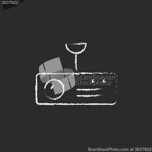 Image of Digital projector icon drawn in chalk.
