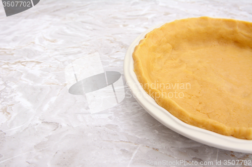 Image of Close-up of pie dish lined with pastry