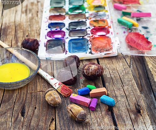 Image of Paint on the autumn table