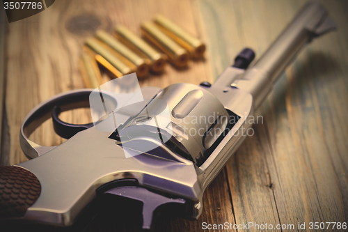 Image of Nagan revolver with cartridges