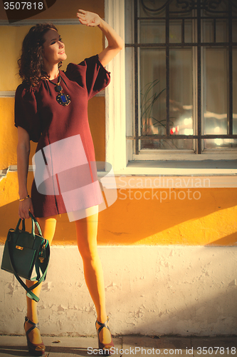 Image of woman in a burgundy dress 