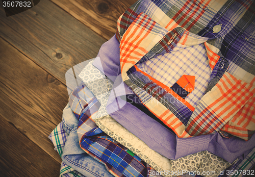 Image of stack of colored shirts