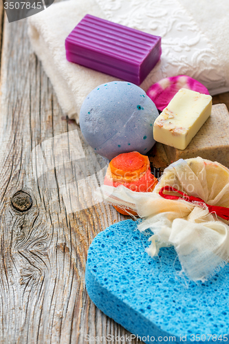 Image of Set for a bath. Towels, soap, scrub, aromatic bomb.