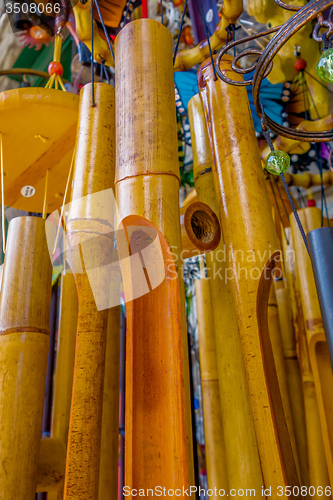 Image of wooden and other wind chimes on display