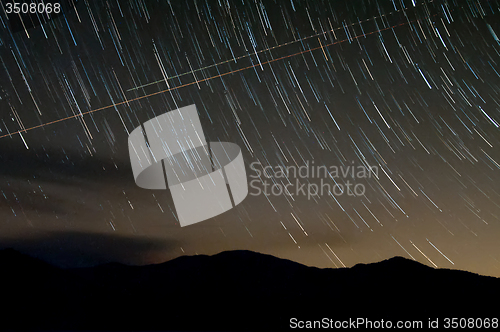 Image of starry night with star trails over lake santeetlah and great smo