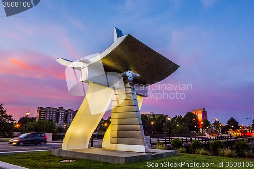 Image of Queens Table Monument and charlotte city skyline early morning