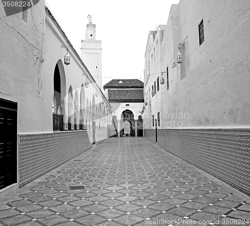 Image of old   brick tower in morocco africa village and the sky