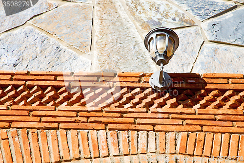 Image of rocks stone and red street lamp