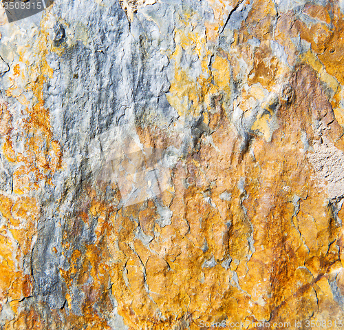 Image of rocks stone and red orange gneiss in the wall of morocco