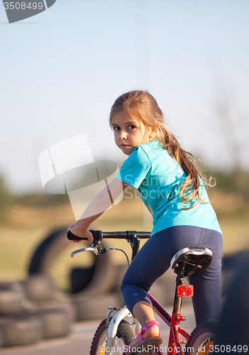 Image of Little girl on bike