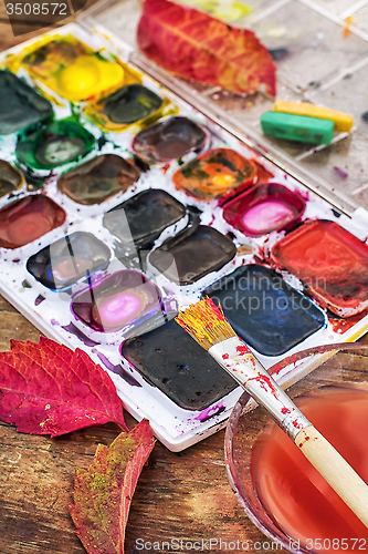 Image of Paint on the autumn table