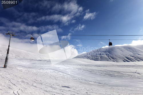 Image of Gondola lift and ski slope