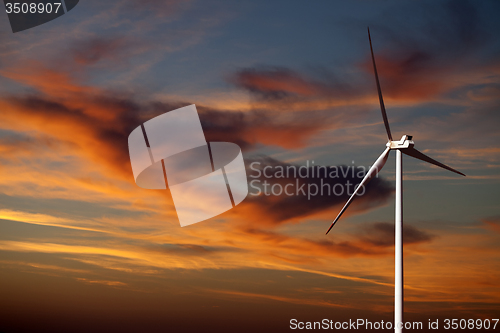 Image of Wind turbine and sunset sky 