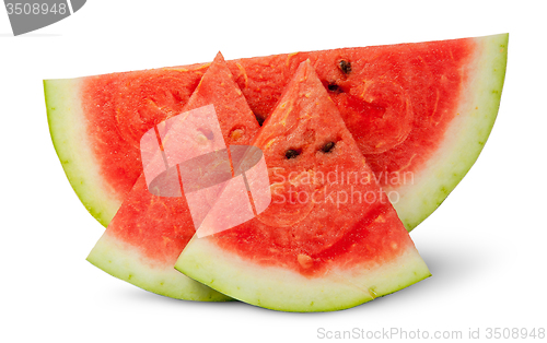 Image of One piece and two segments of ripe watermelon