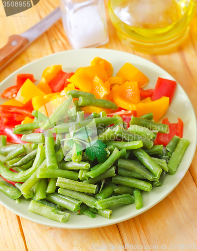Image of Fresh raw vegetables in the green plate