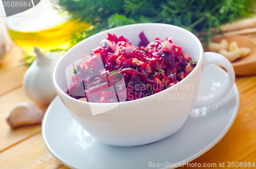 Image of Fresh salad with beet and walnuts, vegetarian salad