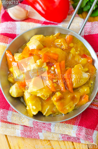 Image of chicken with vegetable in metal plate