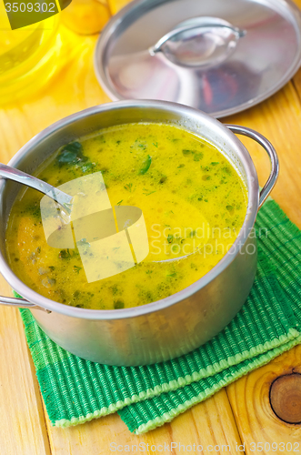 Image of Soup with shrimps and cheese in metal bowl