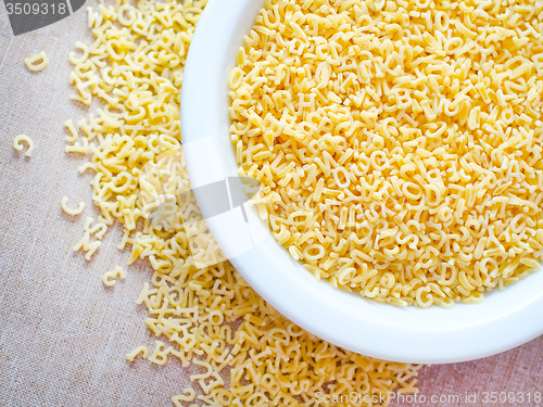 Image of Pasta - alphabet, raw italian pasta in bowl