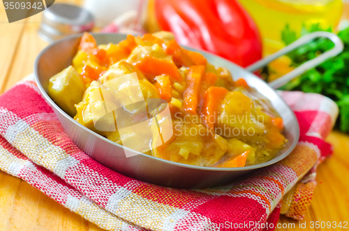 Image of Chicken with vegetable sauce in metal plate