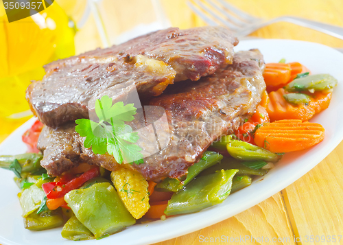 Image of baked meat with vegetables