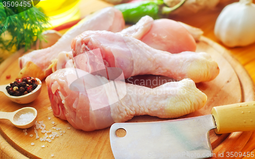 Image of Raw chicken on wooden board, Chicken with spice