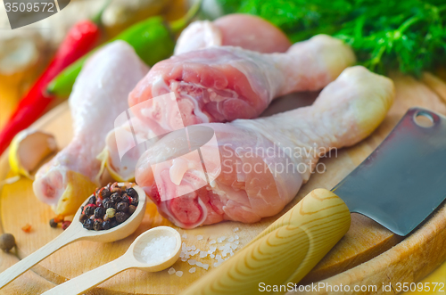 Image of Raw chicken on wooden board, Chicken with spice