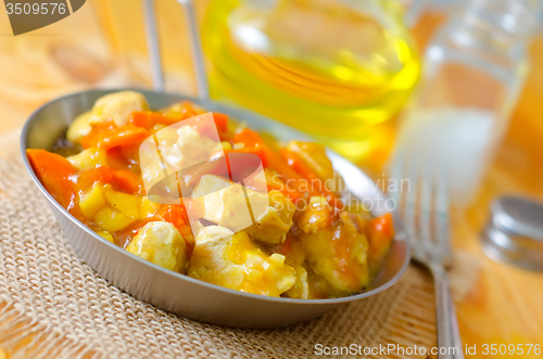 Image of Chicken with vegetable sauce in metal plate