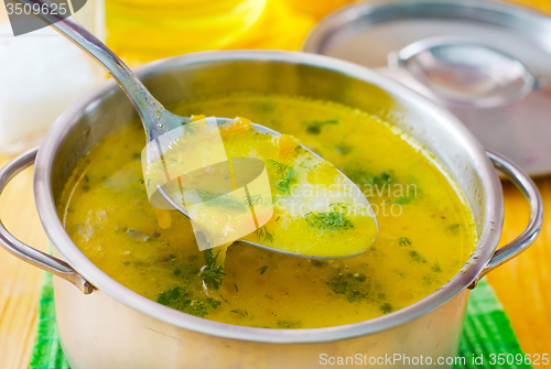 Image of Soup with shrimps and cheese in metal bowl