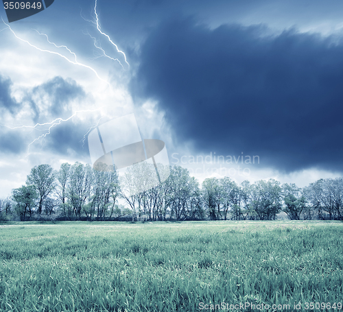 Image of Green field and storm