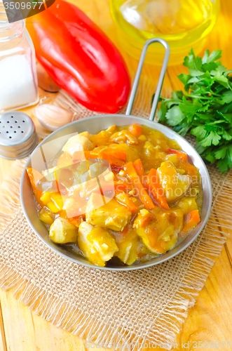 Image of chicken with vegetable in metal plate