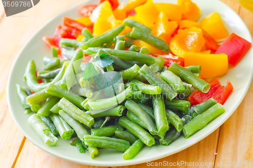 Image of Fresh raw vegetables in the green plate