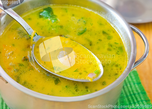 Image of Soup with shrimps and cheese in metal bowl