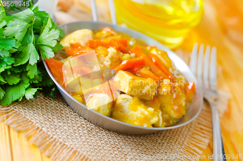 Image of Chicken with vegetable sauce in metal plate
