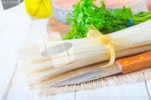 Image of raw rice noodles and raw salmon