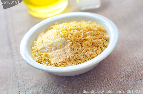 Image of Pasta - alphabet, raw italian pasta in bowl