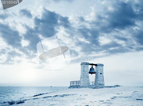 Image of Big ancient bell on the beach in Crimea