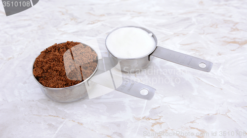 Image of Measuring cups of muscovado and caster sugar