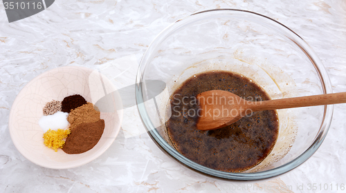 Image of Ingredients for pumpkin pie - spices with egg and sugar filling