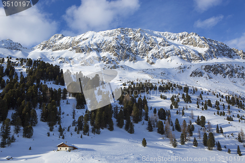 Image of Small house in a wintry mountain landscape