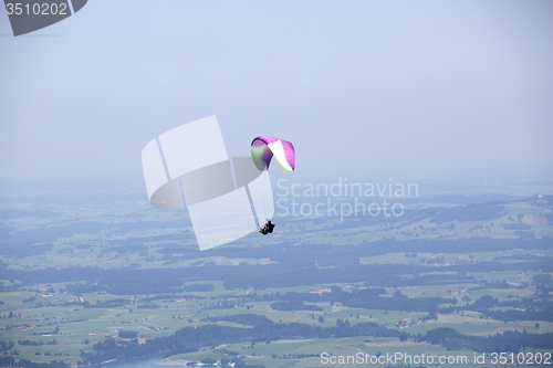 Image of Paragliders flying over Bavarian mountains