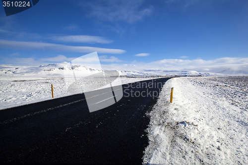 Image of Wet road with impressive landscape 