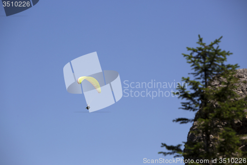 Image of Paraglider flying over Bavarian mountains