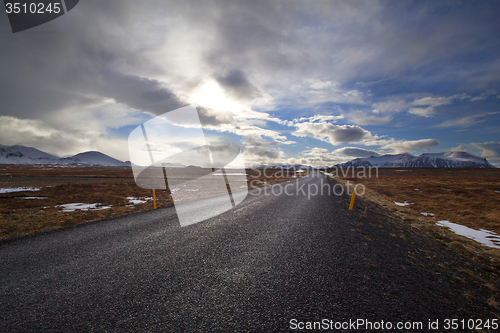 Image of Snowy volcano landscape with dramatic clouds in Iceland