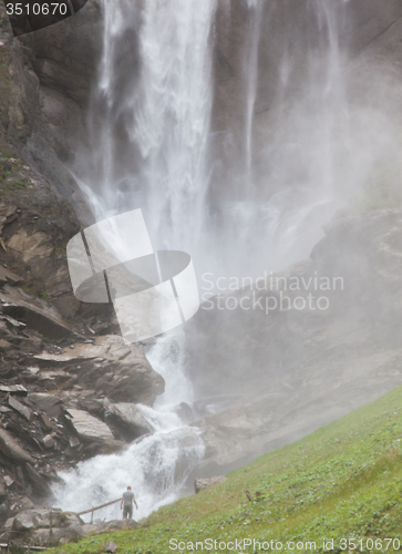 Image of Hiker, young man with large waterfall