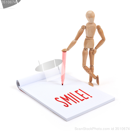 Image of Wooden mannequin writing - Smile