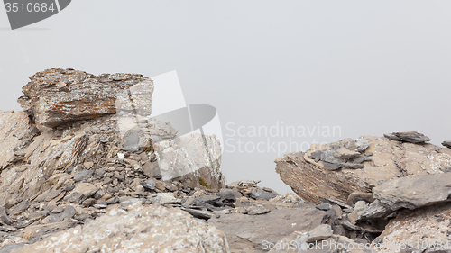 Image of Large boulders in fog