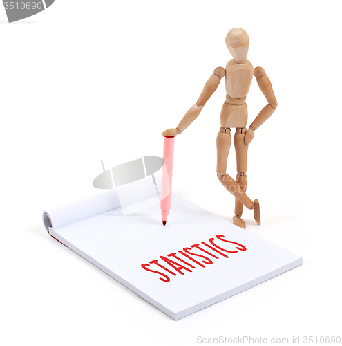 Image of Wooden mannequin writing - Statistics