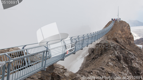 Image of LES DIABLERETS, SWIZTERLAND - JULY 22: People walk at the Glacie